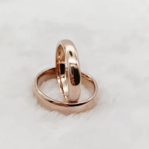 Rose gold matching tungsten wedding bands stacked, showing 6mm men's and 4mm women's widths